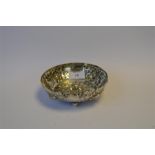 A Continental strawberry dish embossed with flowers and fruit on ball feet. Approx.203 grams. Est £