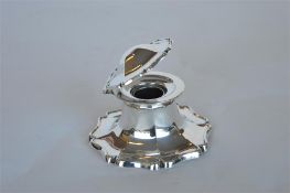 A capstan shaped inkwell of lobed octagonal form resembling a flower. Est. £200 - £250.