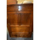 An Antique oak cupboard with three drawers and panelled door. Est. £40 - £60.