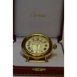 A modern chromed Cartier bedside clock in fitted box complete with original paperwork. Est. £