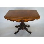 An attractive Victorian walnut card table with scroll feet. Est. £350 - £400.