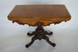 An attractive Victorian walnut card table with scroll feet. Est. £350 - £400.