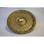 A circular Continental embossed tray, heavily decorated with animals and scrolls. Approx. 520 grams.