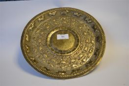 A circular Continental embossed tray, heavily decorated with animals and scrolls. Approx. 520 grams.