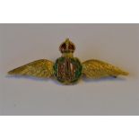 A 9ct enamel decorated RAF brooch with crown top. Approx 6.8 grams. Est. £50 - £60.