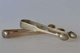 A pair of OE plain sugar tongs. London. By WE & WF, together with another. Approx 88 grams. Est. £20
