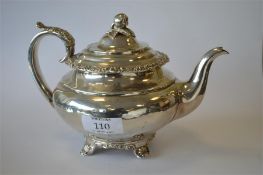 A good Georgian baluster shaped teapot with hinged top, floral rim and bracket feet. Chester 1824.