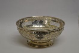 An attractive circular pierced bowl engraved with flowers and leaves. Signed Hansel Sloan & Co.
