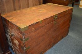 A large camphor wood trunk with brass strap work and corner brackets. 60cms x 58cms x 111cms.