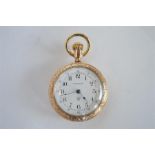 A small gold plated fob watch with white enamelled dial. By Waterbury. Est. £20 - £30.