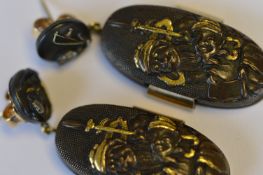 A rare pair of shakudo work drop earrings, the panels decorated with Japanese men, loop tops set