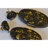 A rare pair of shakudo work drop earrings, the panels decorated with Japanese men, loop tops set