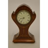 A small Edwardian inlaid mantle clock on ball feet. Est. £30 - £40.