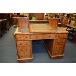 A good oak twin pedestal partner's desk with tilt top and secret drawers. Est. £400 - £450.