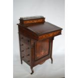 A late Victorian rosewood tilt front Davenport with four drawers to side and fitted interior with