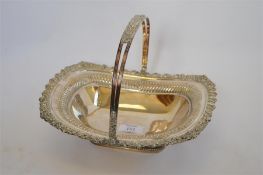 A heavy Georgian style Sheffield plated basket with swing handle. Est. £30 - £40.