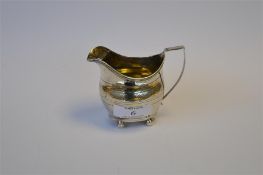 A Georgian bright cut cream jug on ball feet, reeded pouring lip. London 1808. By P&A Bateman. 110