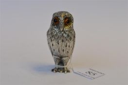 A good quality salt in the form of an owl in standing position with textured feathered body and