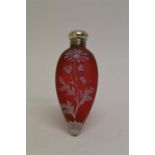 An attractive Webb's cameo red glass scent bottle of teardrop design, decorated either side with