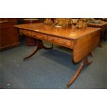 A good six drawer mahogany sofa table with drop sides on reeded supports and brass castors. Est. £