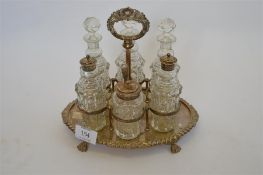 An attractive six bottle cruet with scroll decoration. Est. £200 - £250.