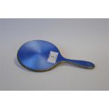 An attractive blue enamelled hand mirror with textured border. Birmingham. By H&M. Est £30 - £40.