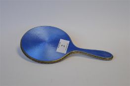 An attractive blue enamelled hand mirror with textured border. Birmingham. By H&M. Est £30 - £40.