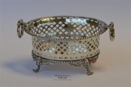 A good quality two handled sweet dish with pierced border, gadroon rim on four hairy feet.