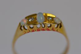 A small opal and diamond six stone ring in 18ct claw mount. Est. £60 - £70.