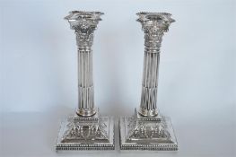 A pair of good Corinthian column candlesticks with tapered supports on step bases. Sheffield 1896 by