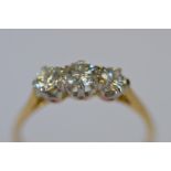 A good diamond three stone ring in two colour gold. Approx. 0.85ct. Est. £750 - £800.