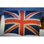 A massive Union flag. Approx. 4m x 5m. In good condition. Est. £300 - £400.