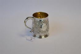 A Georgian half pint mug with scroll handle, the body decorated with flowers and scrolls on pedestal