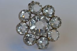 A rock crystal large circular 9 stone brooch in silver claw mount. Est. £30 - £40.