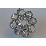 A rock crystal large circular 9 stone brooch in silver claw mount. Est. £30 - £40.