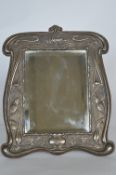 A large Art Nouveau dressing table mirror decorated with Kingfishers and textured body. Vacant