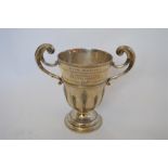 A good quality two handled trophy cup with reeded sides on pedestal base. Inscribed "Royal Air Force