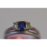 An attractive sapphire and diamond three stone baguette cut ring set in platinum together with a