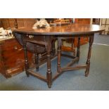 An early 18th Century oak drop leaf table with single drawer. Est. £80 - £100.