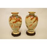 A pair of Satsuma vases and stands. Est. £100 - £120.