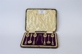 A boxed set of 5 bright cut teaspoons plu one other and matching tongs. Sheffield 1926. By JR.