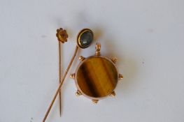 A bloodstone set fob together with two gold stick pins. £30 - £40.