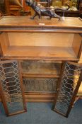 An oak three stack Globe Wernicke bookcase. Est. £60 - £80.