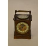 A large French chiming carriage clock with enamelled dial and bracket feet, the top inset with