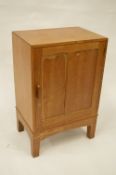 A good oak bedside chest on tapering supports. Est. £20 - £30.