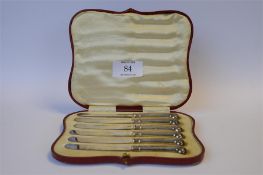 A set of six pistol mounted tea knives in fitted box. Est. £25 - £30.