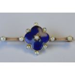 An Antique enamelled brooch with pearl border and knife edged spaces set in gold. Approx. 3 grams.