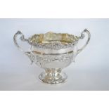 A good heavy two handled embossed bowl with floral decoration. By James Deakin. £700 - £750.