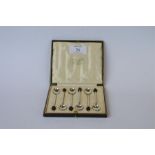 A boxed set of 6 bean topped coffee spoons. Birmingham 1922. By S Ltd. Est. £20 - £30.