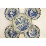 A set of four Delft plates, together with one other. Est. £20 - £30.